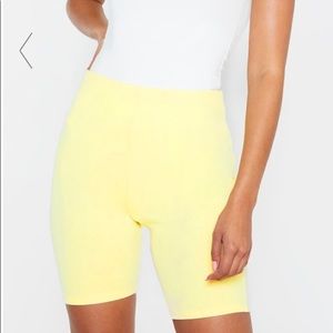 PRETTYLITTLETHING Pale Lemon Biker Shorts